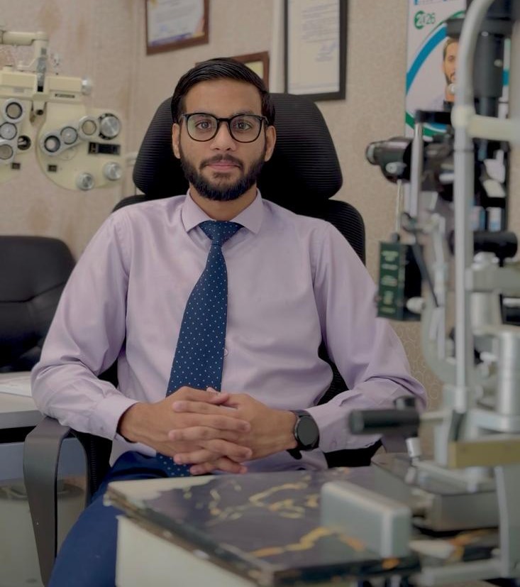 Dr. Zain Ul Abidin seated at clinic desk